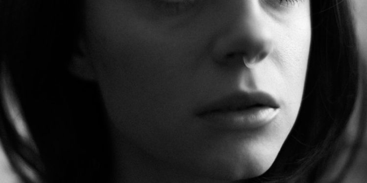 grayscale photo of womans face